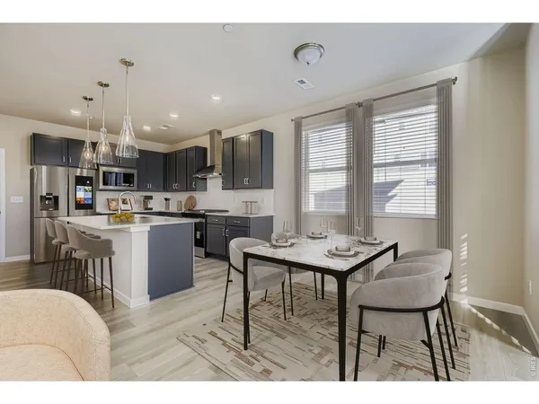 a large kitchen with stainless steel appliances lots of counter top space