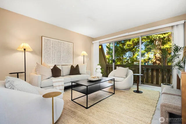 a living room with furniture and a large window