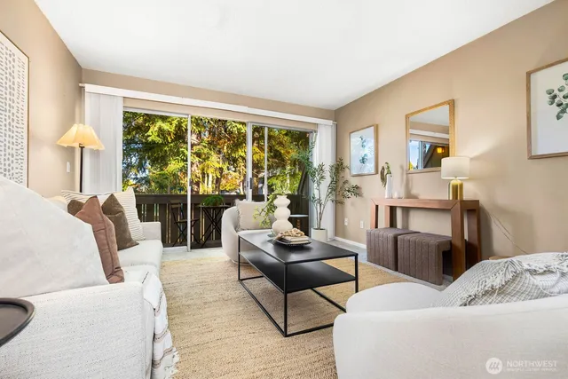 a living room with furniture and a large window
