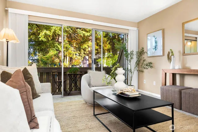a living room with furniture and a large window