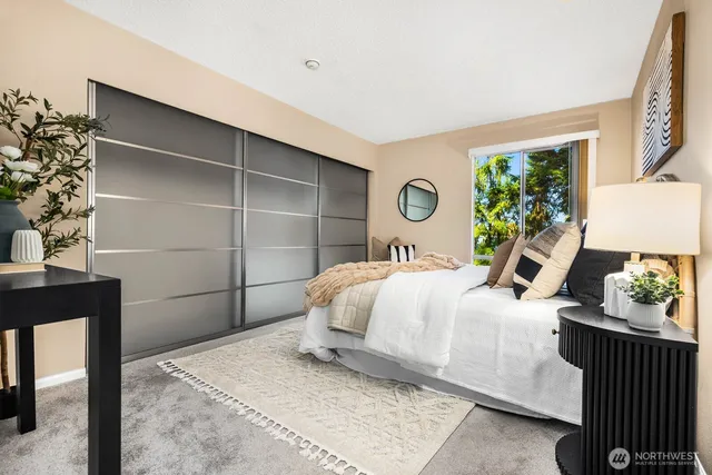 a bedroom with a bed and a window