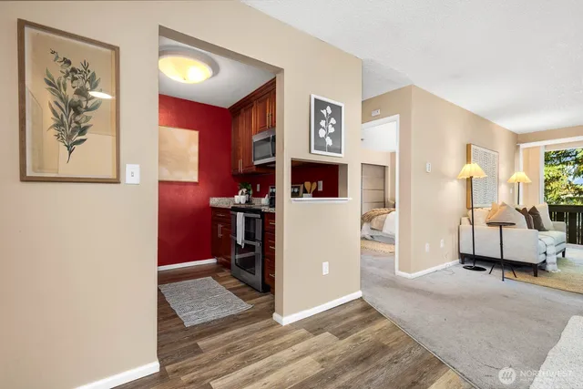 a view of a livingroom with workspace and a window