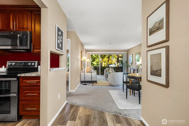 a dining room with furniture and a window