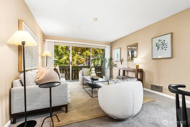 a living room with furniture and a large window