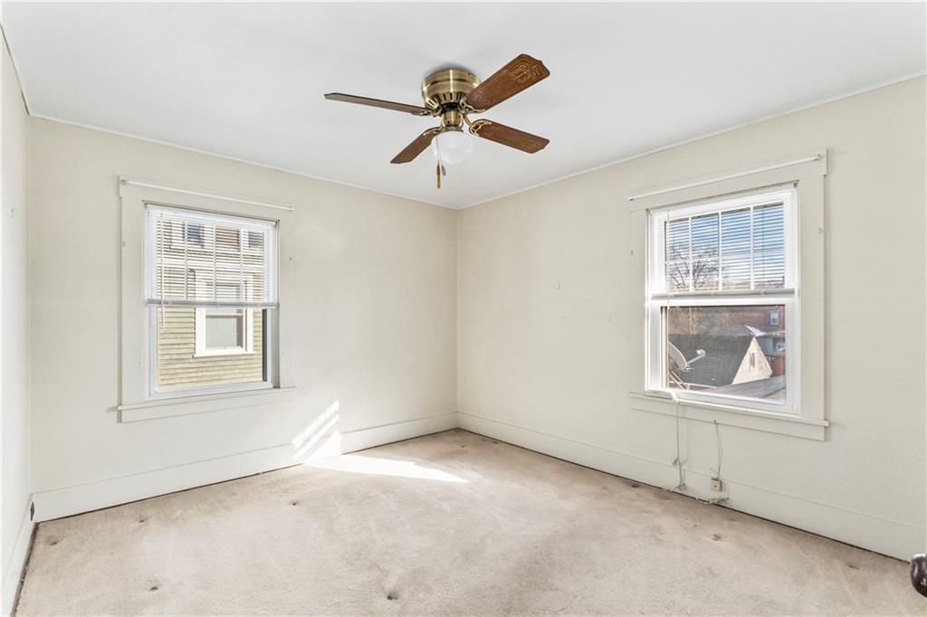 745 Bank Street Beaver, PA 15009 - Photo 17 of 30 an empty room with a window and a ceiling fan