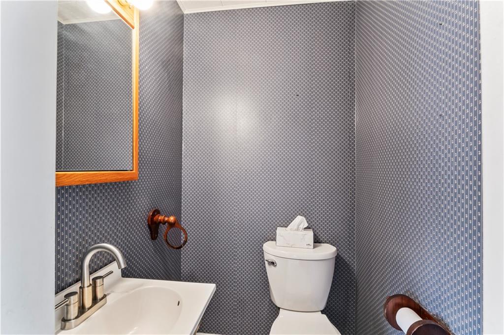 745 Bank Street Beaver, PA 15009 - Photo 28 of 30 a bathroom with a toilet sink and mirror