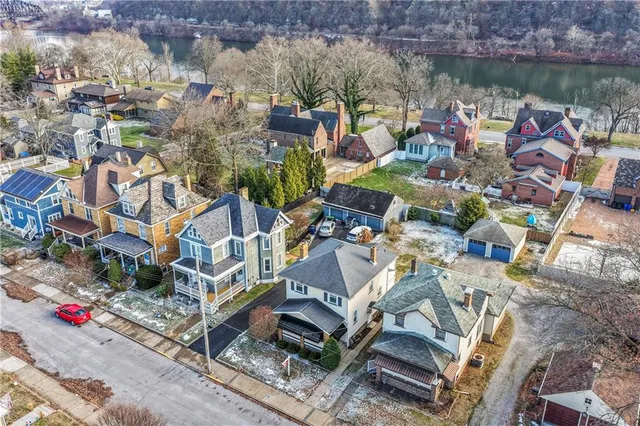 an aerial view of a house with a lake view