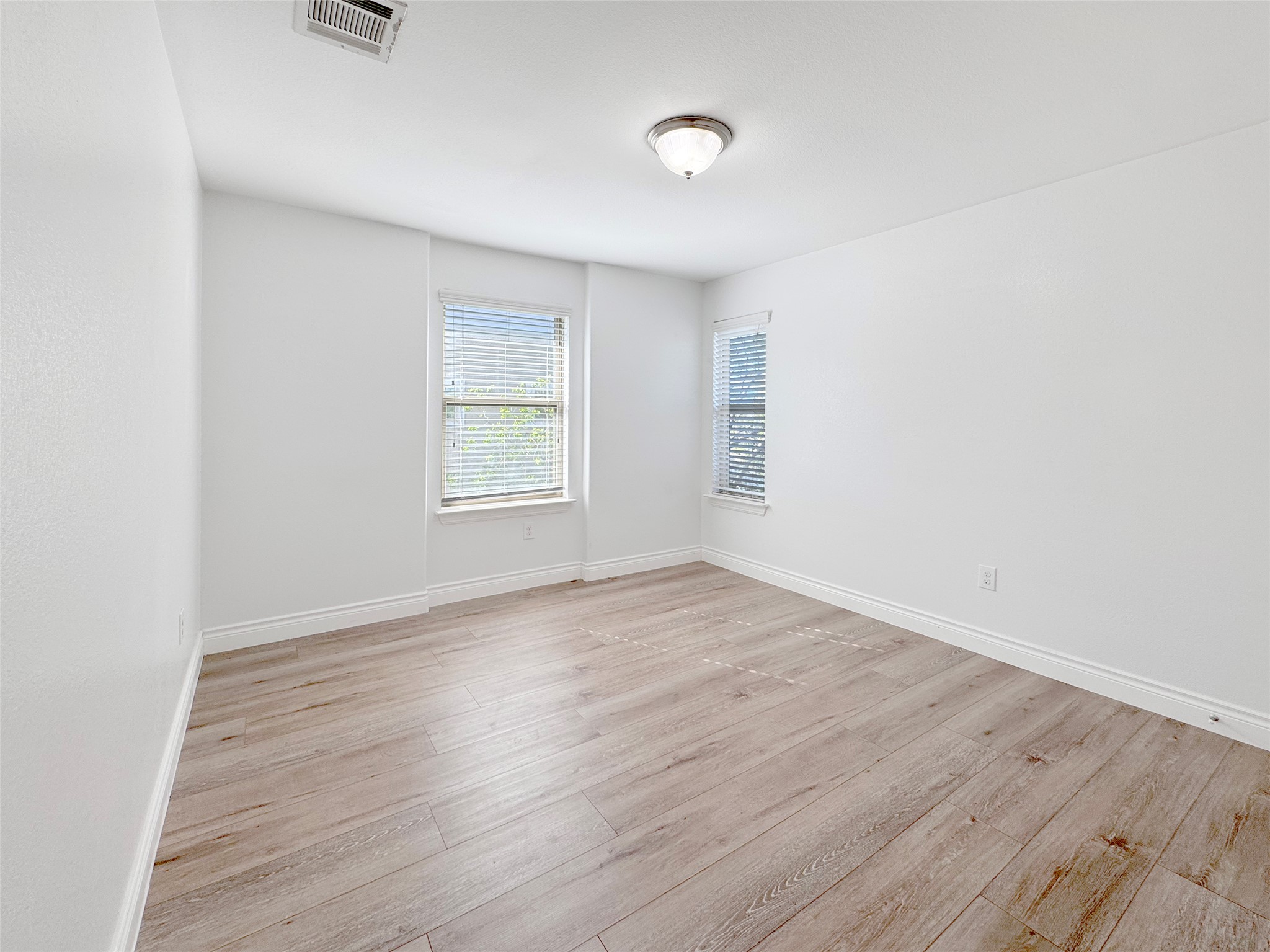 251 Triumph Road Buda, TX 78610 - Photo 15 of 24 Unfurnished room featuring light wood-style floors