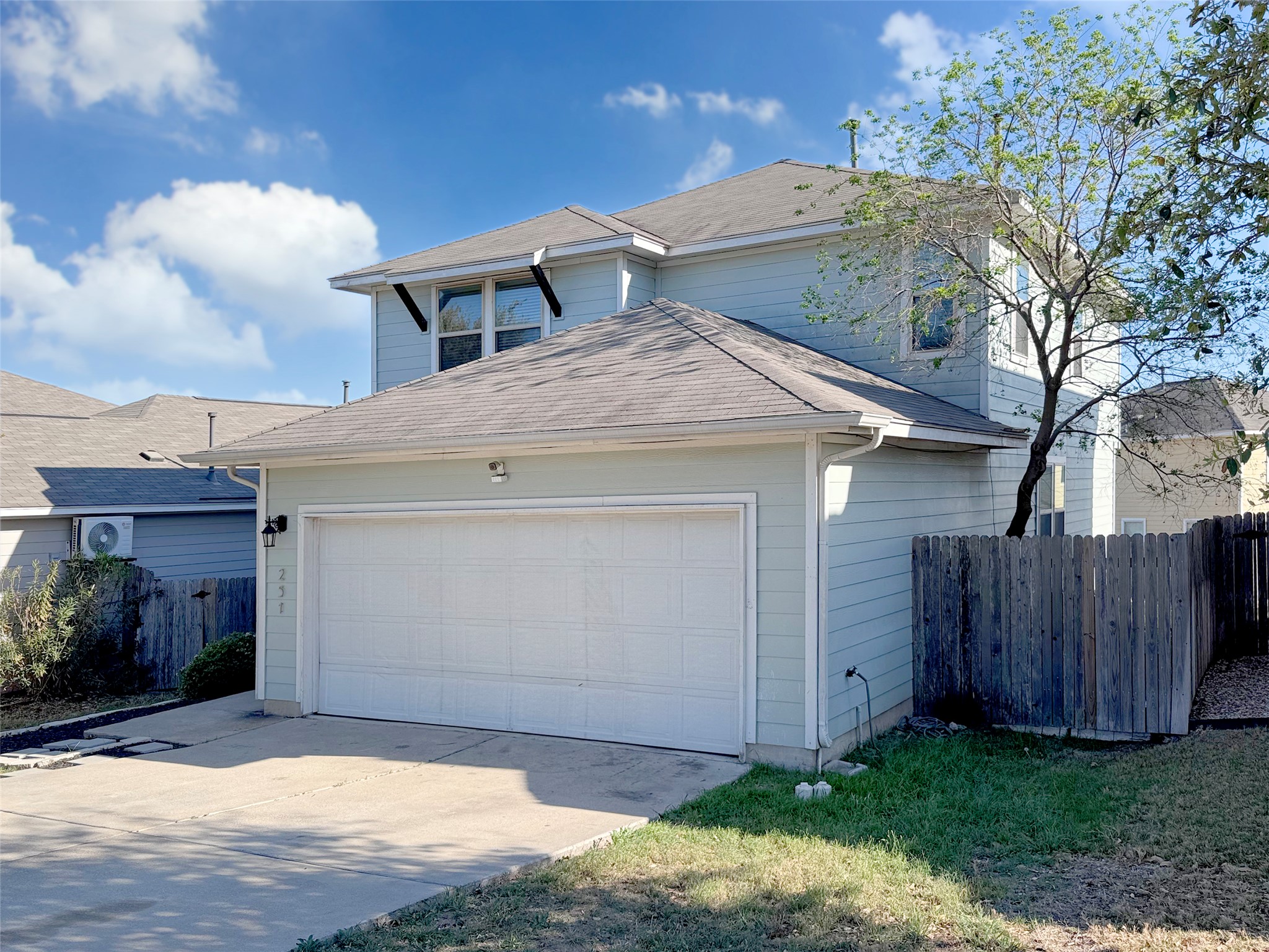 251 Triumph Road Buda, TX 78610 - Photo 3 of 24 View of front of house with driveway, a garage, and a shingled roof