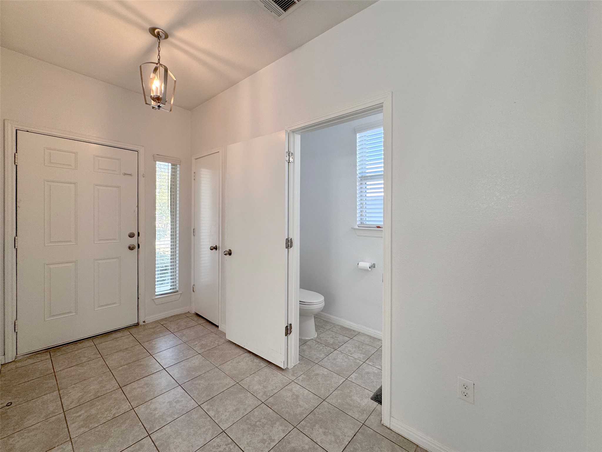 251 Triumph Road Buda, TX 78610 - Photo 6 of 24 Foyer featuring light tile patterned floors and baseboards