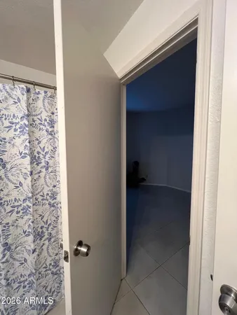 a bathroom with a granite countertop sink a toilet and a mirror