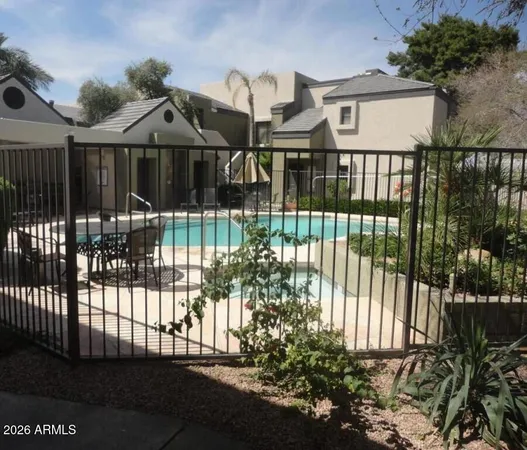 a view of a house with a small yard and plants