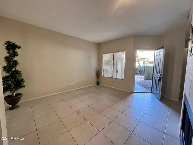 a kitchen with stainless steel appliances kitchen island granite countertop a sink a stove a counter top space and cabinets