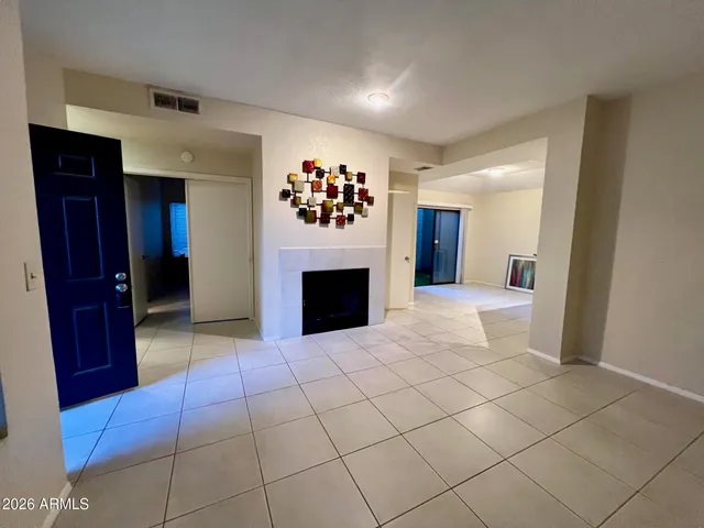 a kitchen with stainless steel appliances kitchen island granite countertop a refrigerator and a stove top oven