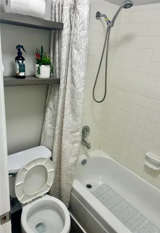 a bathroom with a sink a toilet and a bathtub