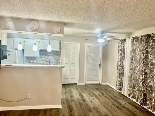 a view of a bathroom with sink and mirror