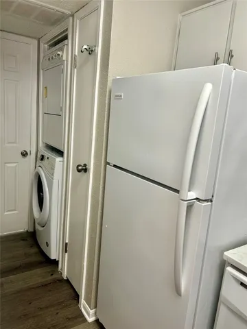 a view of a storage and utility room with a washer dryer