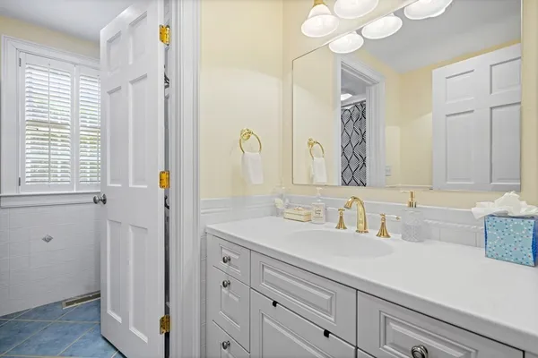 a bathroom with a sink a vanity and a mirror