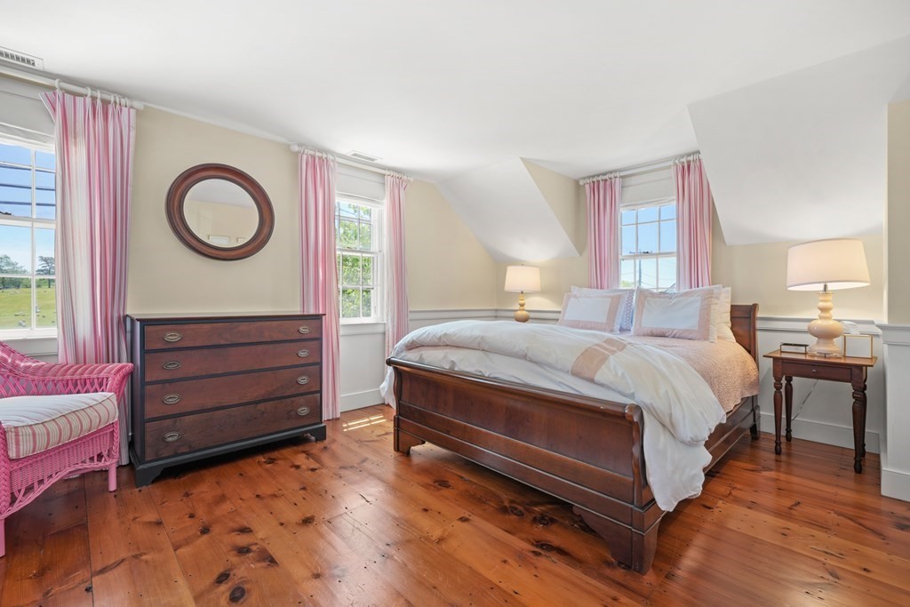 39 Milk Street Nantucket, MA 02554 - Photo 18 of 22 a bedroom with a bed and a dresser