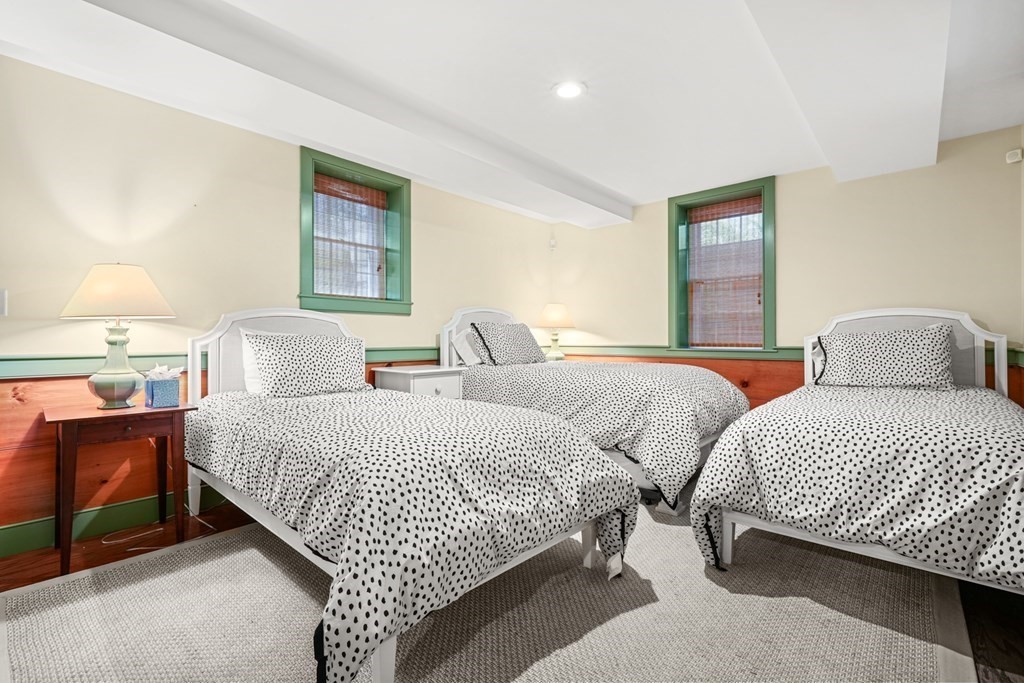 39 Milk Street Nantucket, MA 02554 - Photo 20 of 22 a bedroom with two beds and a night stand