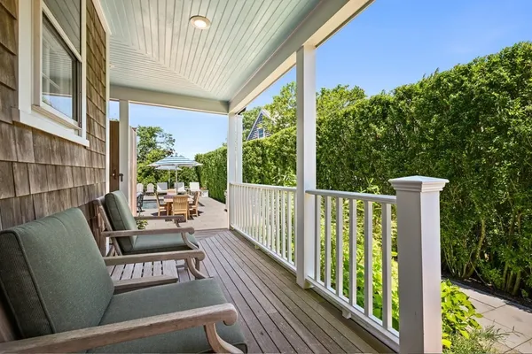 a view of balcony with furniture