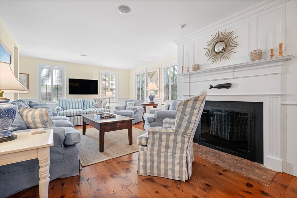 39 Milk Street Nantucket, MA 02554 - Photo 10 of 22 a living room with furniture a fireplace and a flat screen tv
