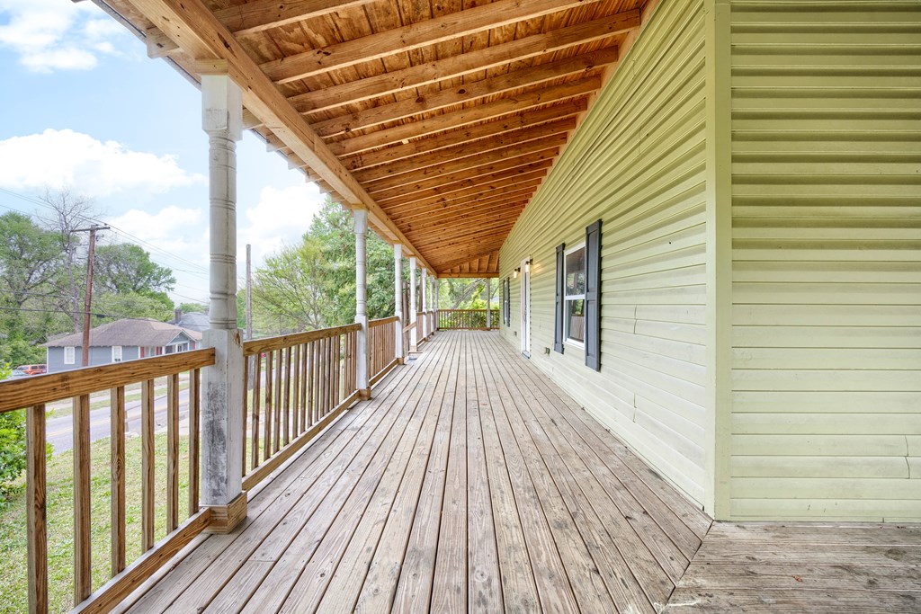 2113 Summerville Road Phenix City, AL 36867 - Photo 6 of 37 a view of a balcony with wooden floor