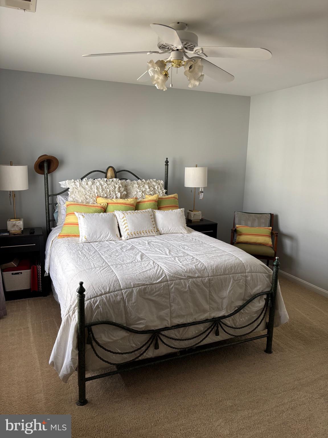 3910 Squire Tuck Way Baltimore, MD 21208 - Photo 13 of 40 a bedroom with a bed and a chandelier