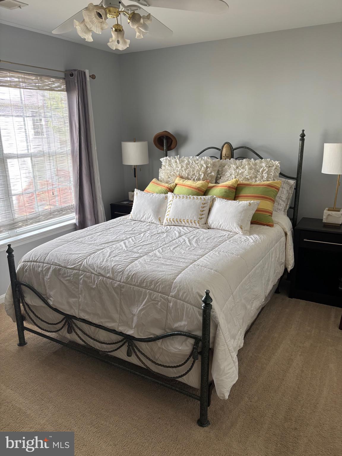 3910 Squire Tuck Way Baltimore, MD 21208 - Photo 14 of 40 a large bed sitting in a bedroom next to a window