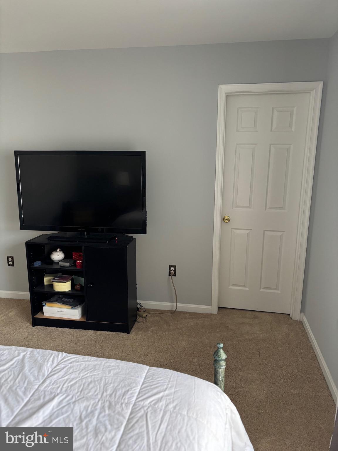 3910 Squire Tuck Way Baltimore, MD 21208 - Photo 15 of 40 a bedroom with bed and flat screen tv