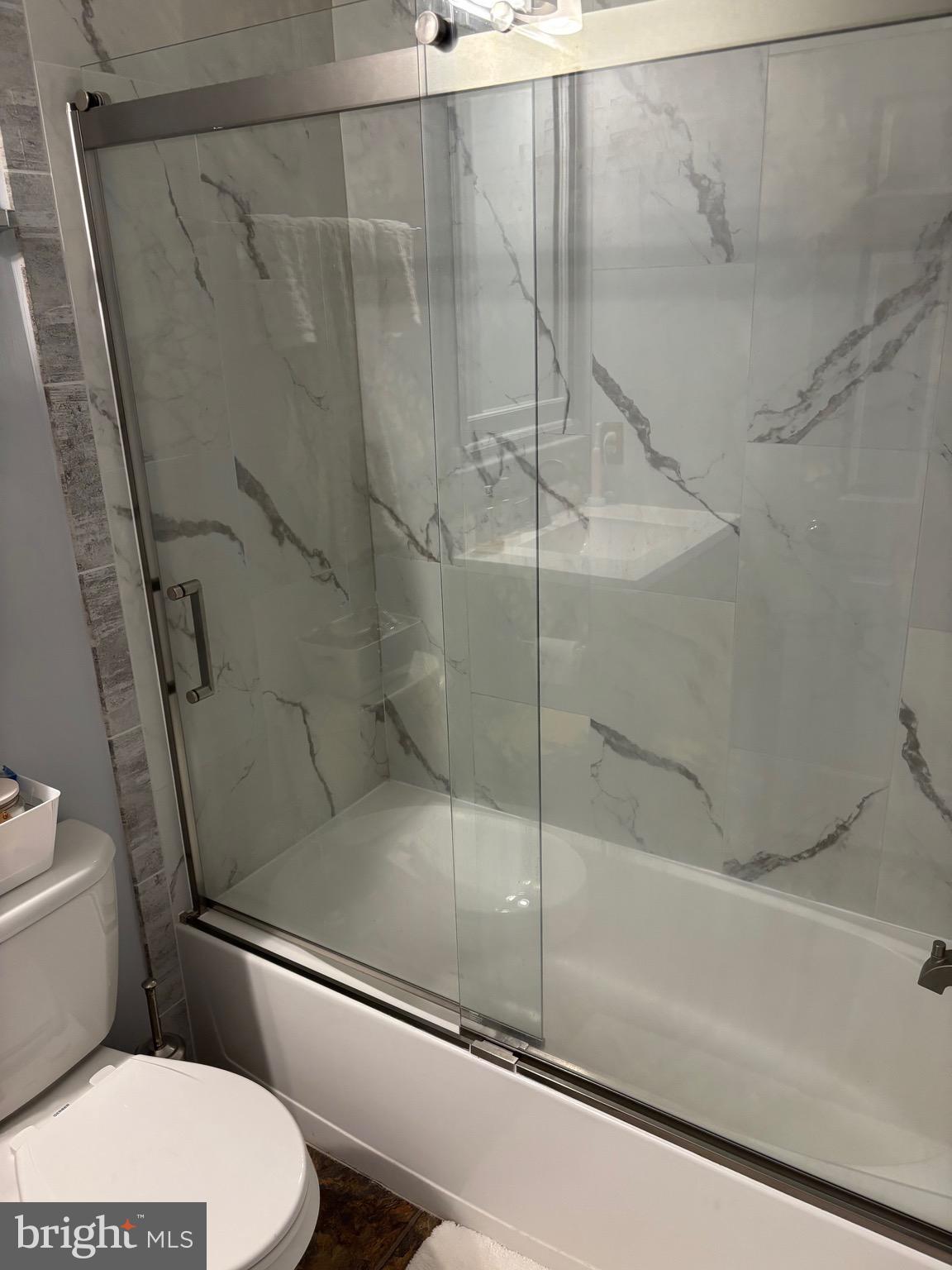 3910 Squire Tuck Way Baltimore, MD 21208 - Photo 17 of 40 a bathroom with a toilet and a shower