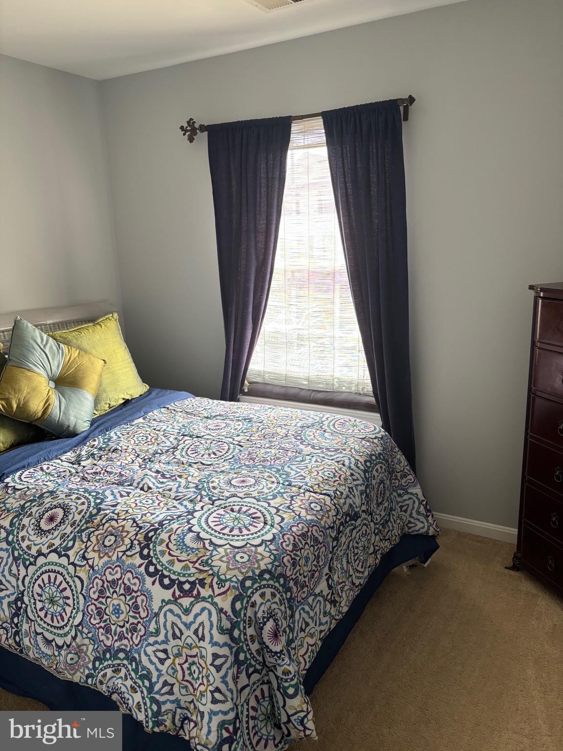 3910 Squire Tuck Way Baltimore, MD 21208 - Photo 19 of 40 a bedroom with a bed and a window