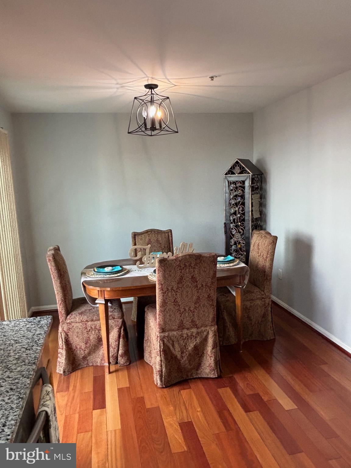 3910 Squire Tuck Way Baltimore, MD 21208 - Photo 6 of 40 a workspace with furniture and wooden floor