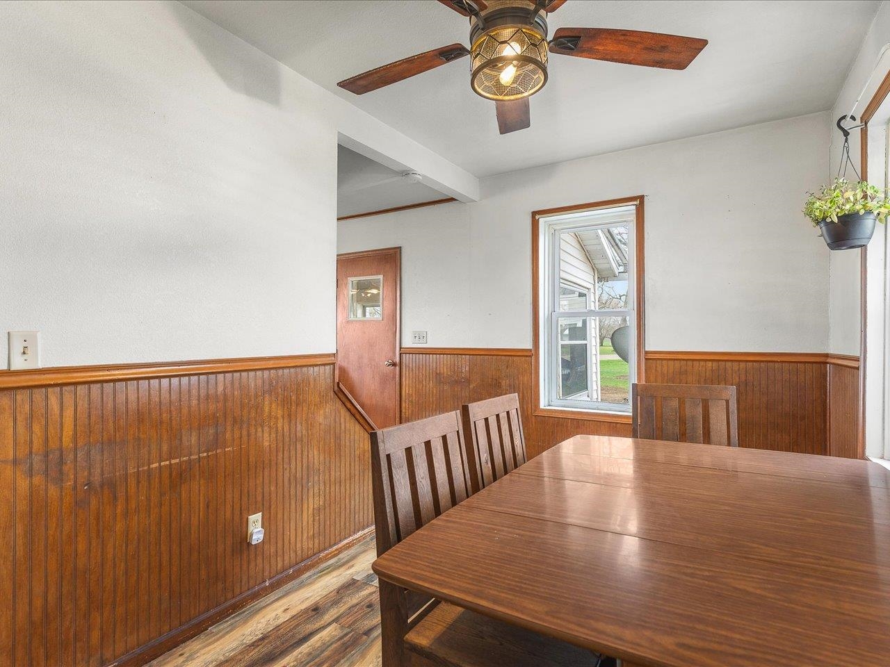 13514 Northeast Winslow Road Winslow, IL 61089 - Photo 11 of 31 a view of a dining room with furniture wooden floor and chandelier