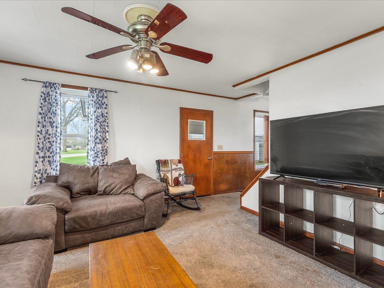 13514 Northeast Winslow Road Winslow, IL 61089 - Photo 15 of 31 a living room with furniture and a flat screen tv
