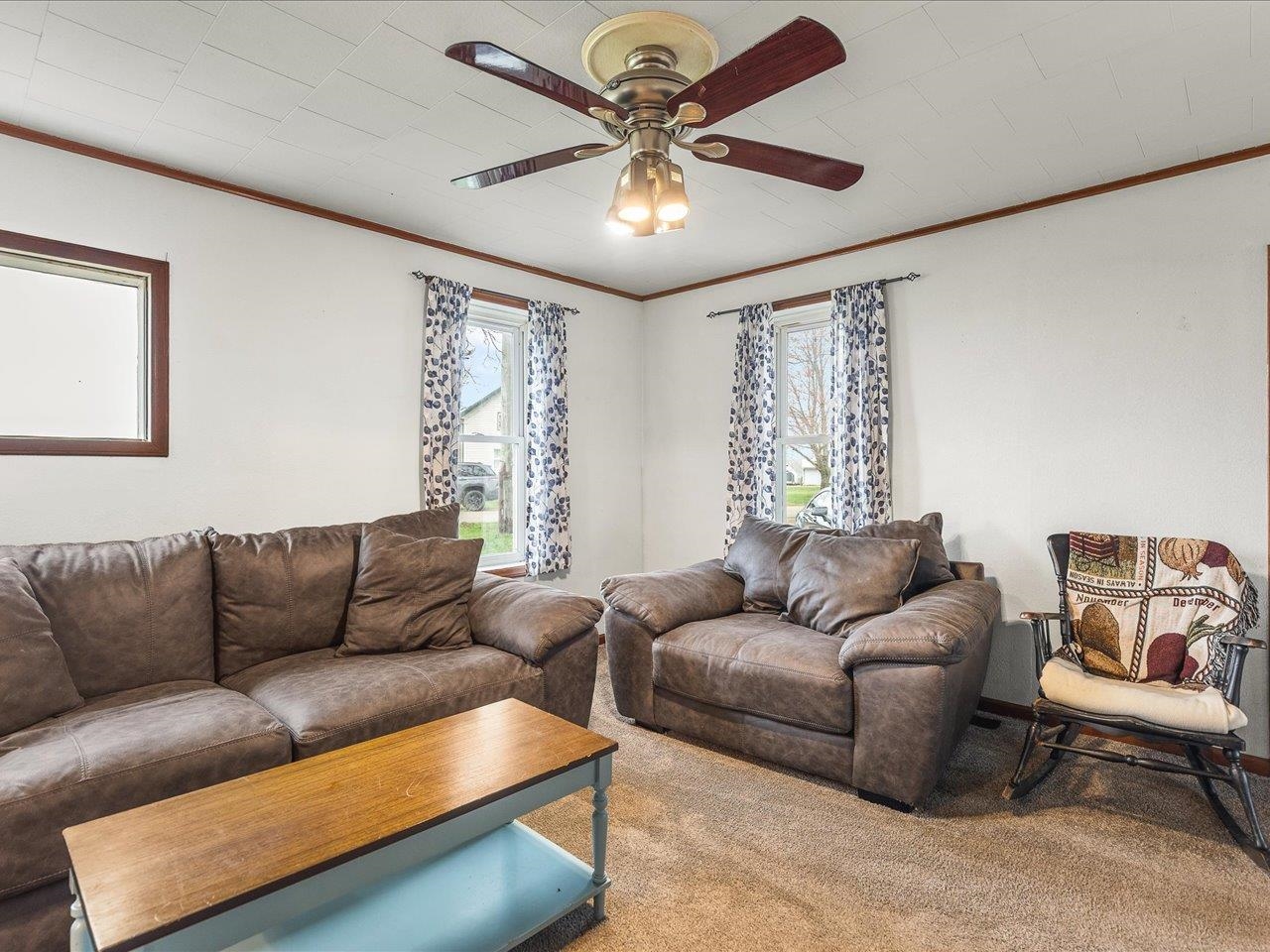 13514 Northeast Winslow Road Winslow, IL 61089 - Photo 16 of 31 a living room with furniture and a large window