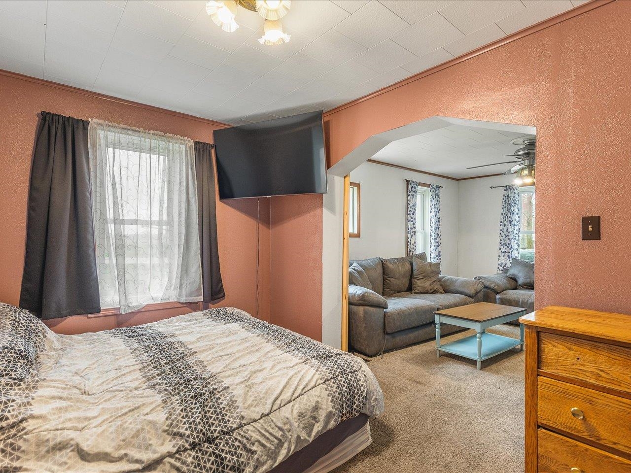 13514 Northeast Winslow Road Winslow, IL 61089 - Photo 17 of 31 a bedroom with a bed and a couch