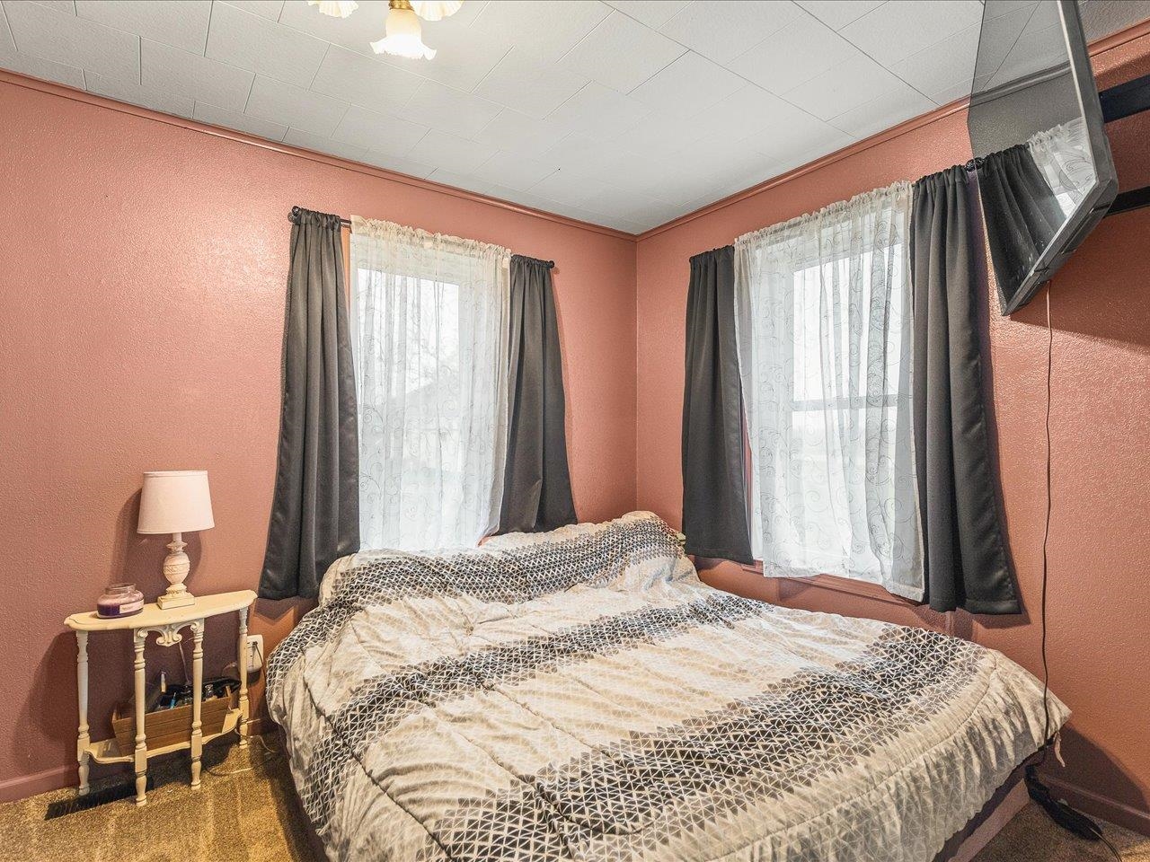 13514 Northeast Winslow Road Winslow, IL 61089 - Photo 18 of 31 a bedroom with a bed and a window