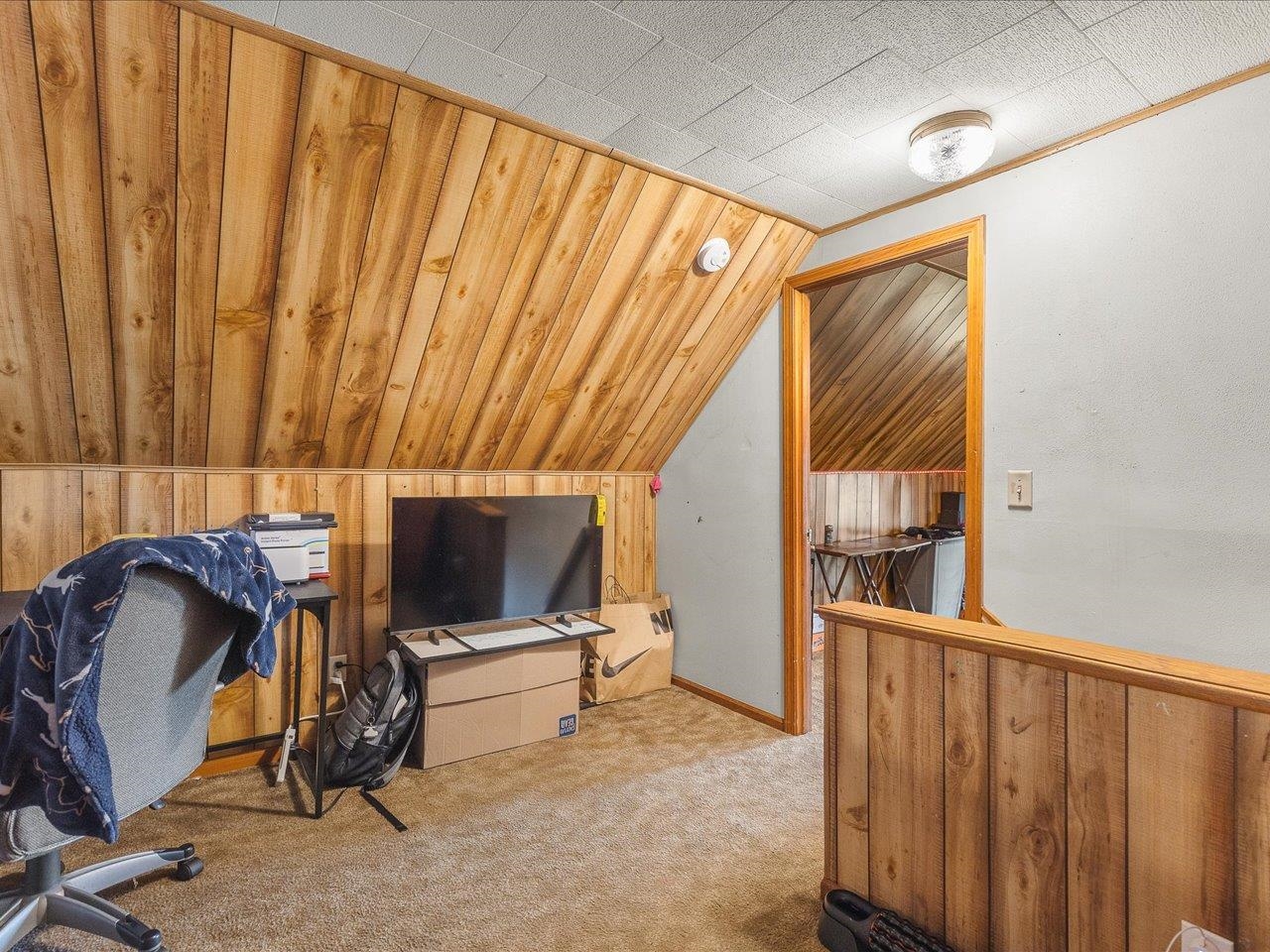 13514 Northeast Winslow Road Winslow, IL 61089 - Photo 23 of 31 a living room with furniture a flat screen tv and a window