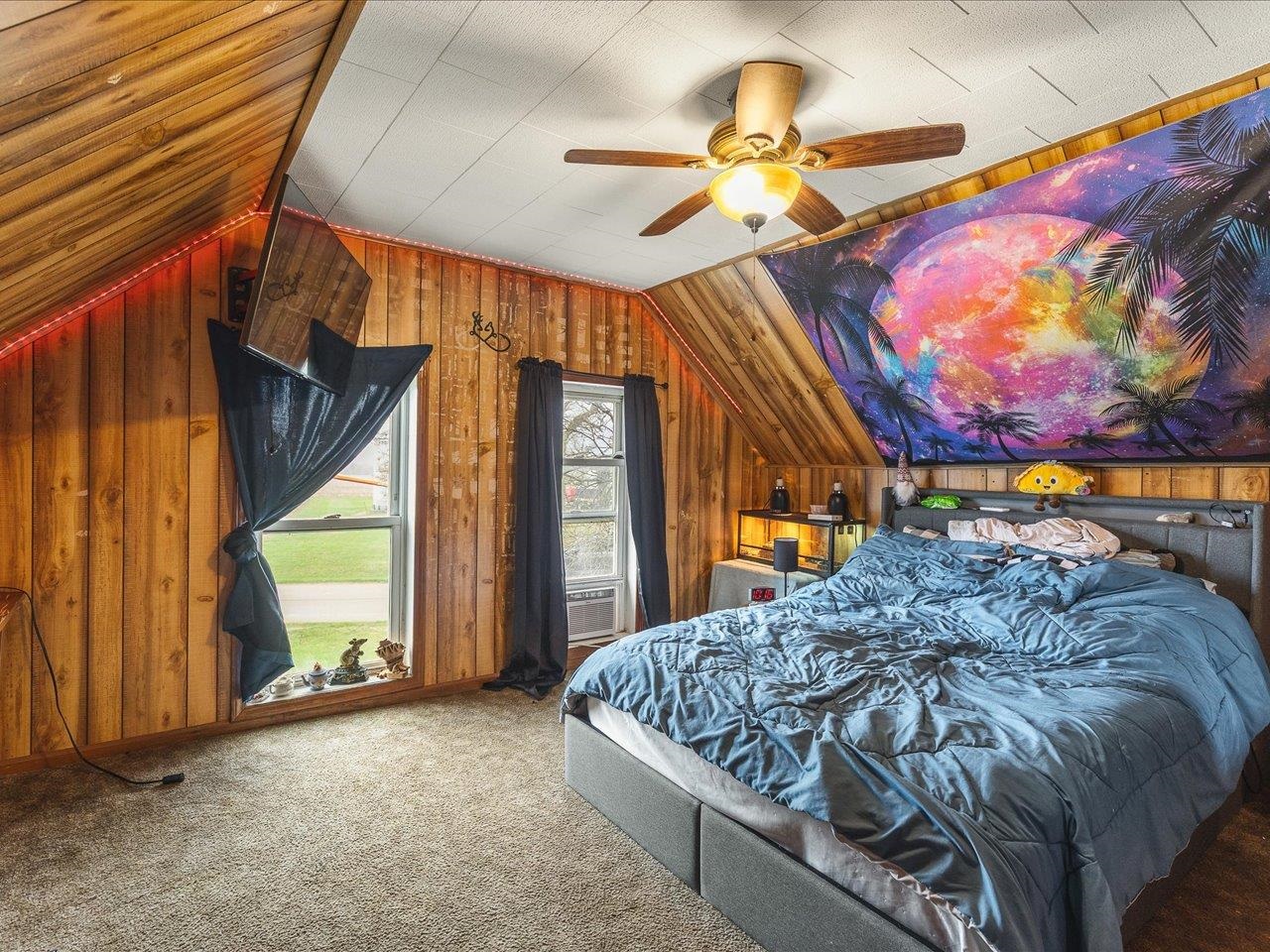 13514 Northeast Winslow Road Winslow, IL 61089 - Photo 24 of 31 a bed sitting in a bedroom next to a window