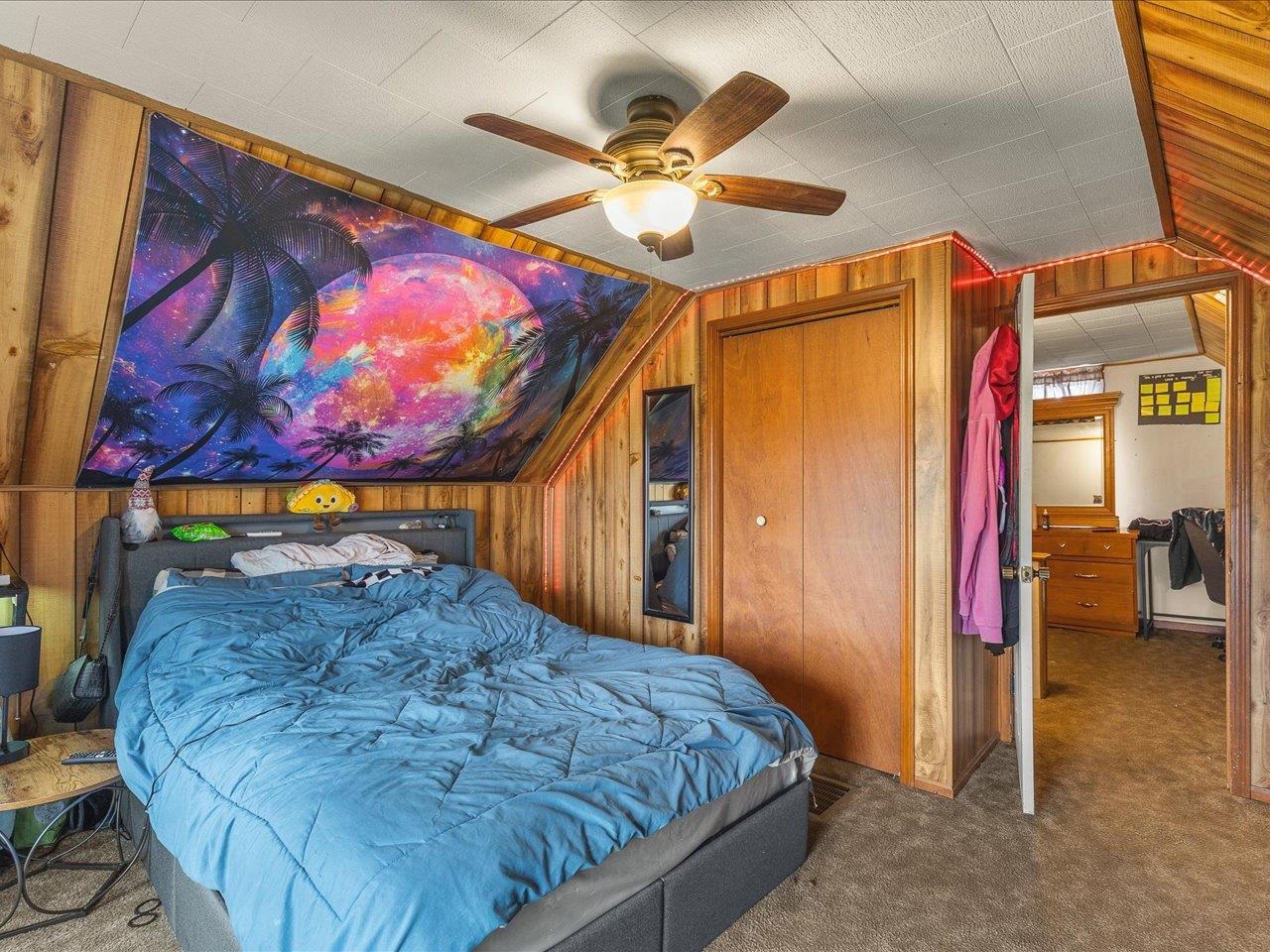 13514 Northeast Winslow Road Winslow, IL 61089 - Photo 25 of 31 a bedroom with a bed and a painting on the wall