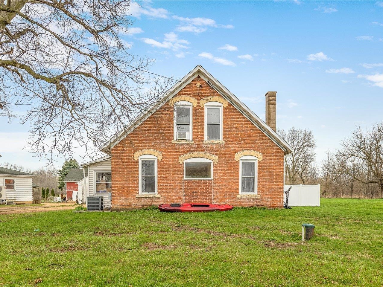 13514 Northeast Winslow Road Winslow, IL 61089 - Photo 26 of 31 a view of a house with a yard