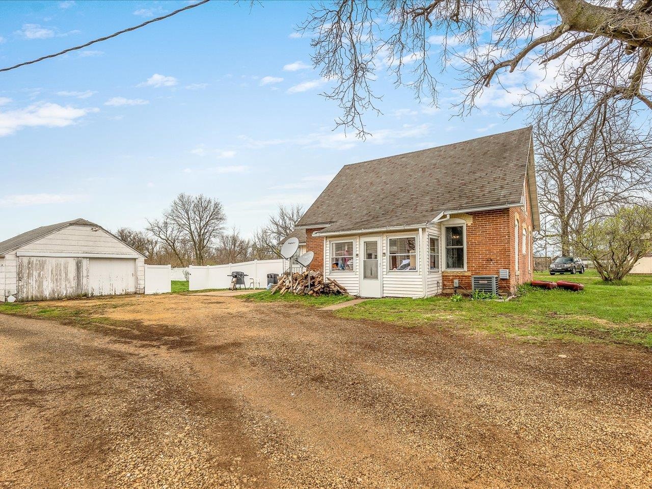 13514 Northeast Winslow Road Winslow, IL 61089 - Photo 27 of 31 a view of a yard in front of a house with a large tree