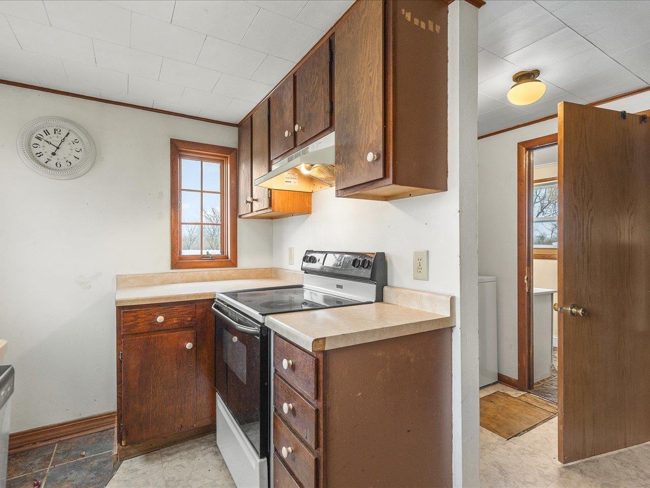 13514 Northeast Winslow Road Winslow, IL 61089 - Photo 3 of 31 a kitchen that has a sink and a stove in it
