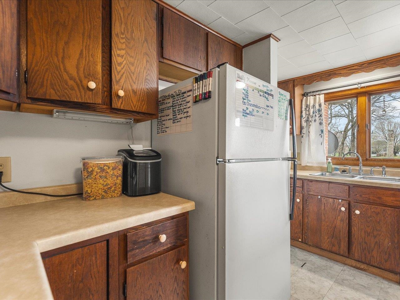 13514 Northeast Winslow Road Winslow, IL 61089 - Photo 6 of 31 a kitchen with stainless steel appliances a refrigerator and a sink