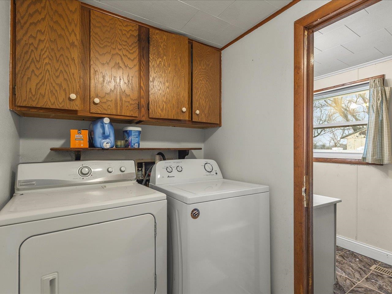 13514 Northeast Winslow Road Winslow, IL 61089 - Photo 7 of 31 a view of storage and utility room with washer and dryer