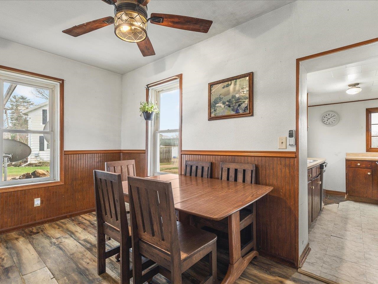 13514 Northeast Winslow Road Winslow, IL 61089 - Photo 10 of 31 a view of a dining room with furniture window and wooden floor