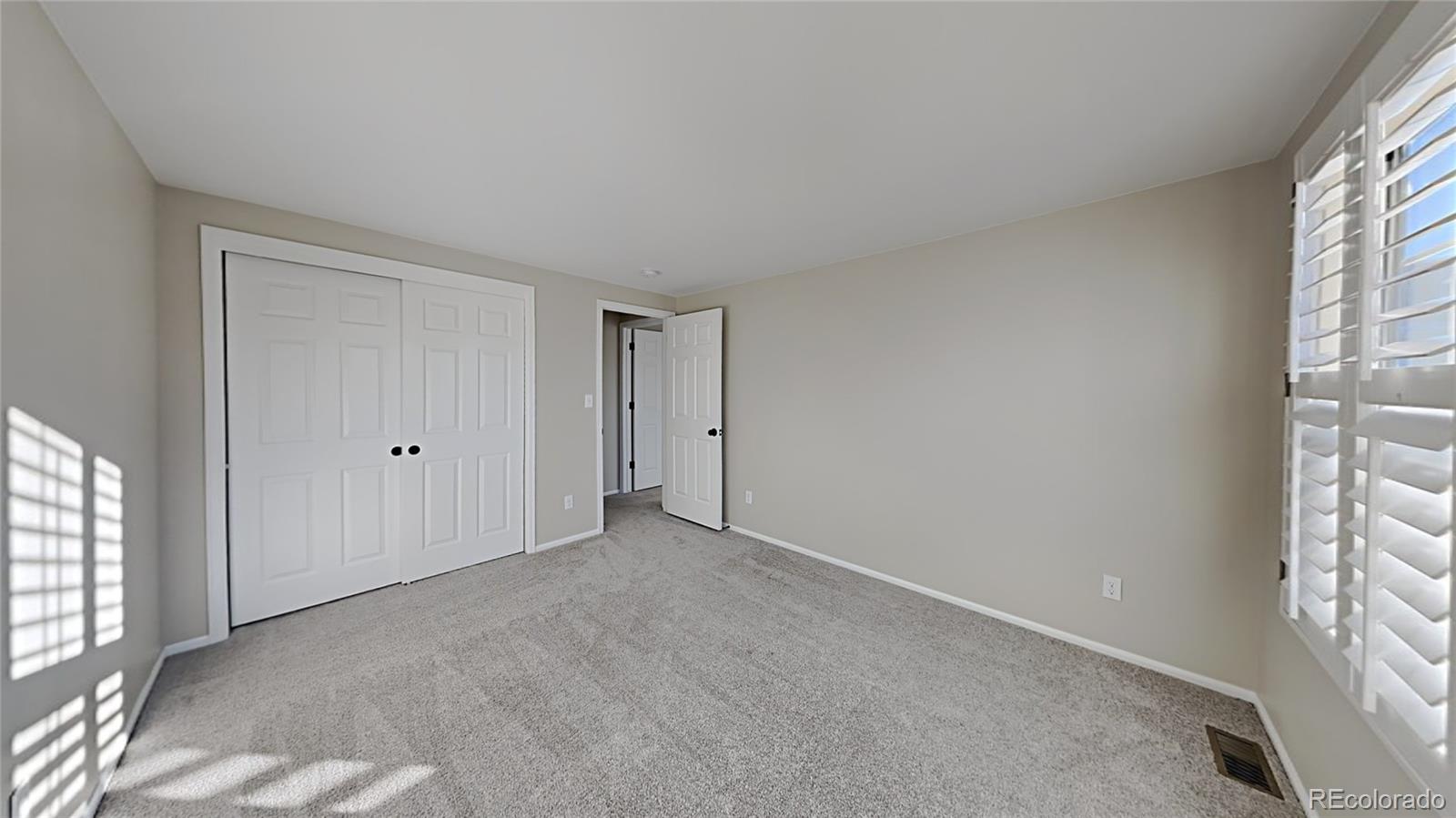 8774 Forrest Court Highlands Ranch, CO 80126 - Photo 19 of 31 a view of an empty room with a window