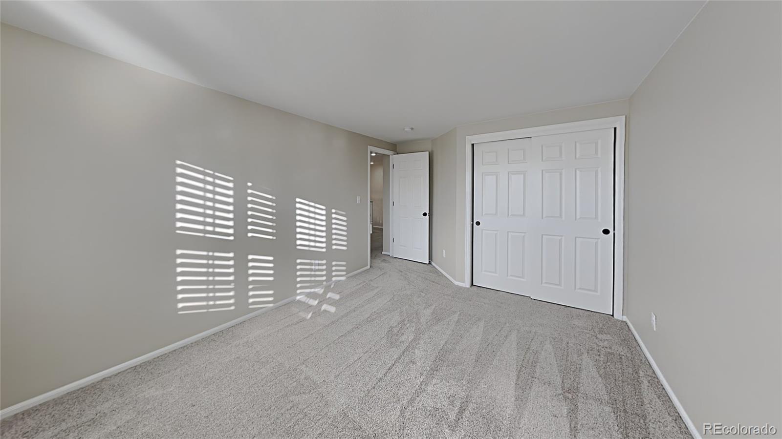 8774 Forrest Court Highlands Ranch, CO 80126 - Photo 20 of 31 a view of empty room with windows