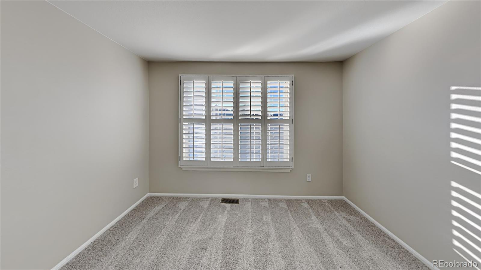 8774 Forrest Court Highlands Ranch, CO 80126 - Photo 21 of 31 an empty room with a window